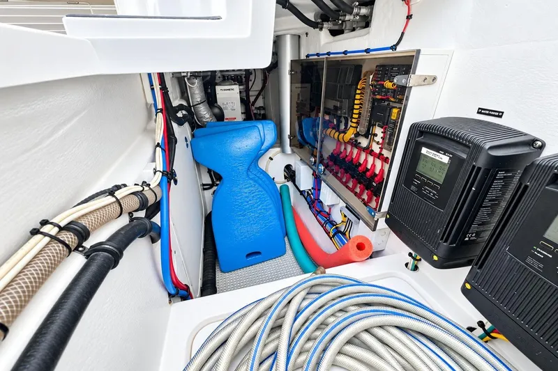 Slide: The Image of Engine room of 2022 Intrepid 477 Evolution boat with wiring and equipment. - 24
