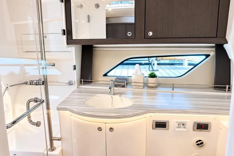 Slide: The Image of Luxurious bathroom interior of 2022 Intrepid 477 Evolution yacht with modern fixtures. - 43