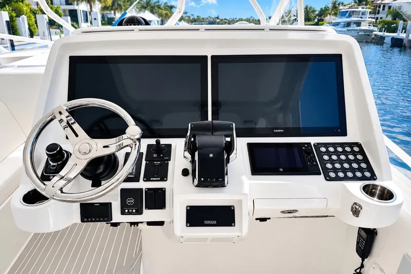 Slide: The Image of 2022 Intrepid 477 Evolution helm with dual screens and modern controls. - 19