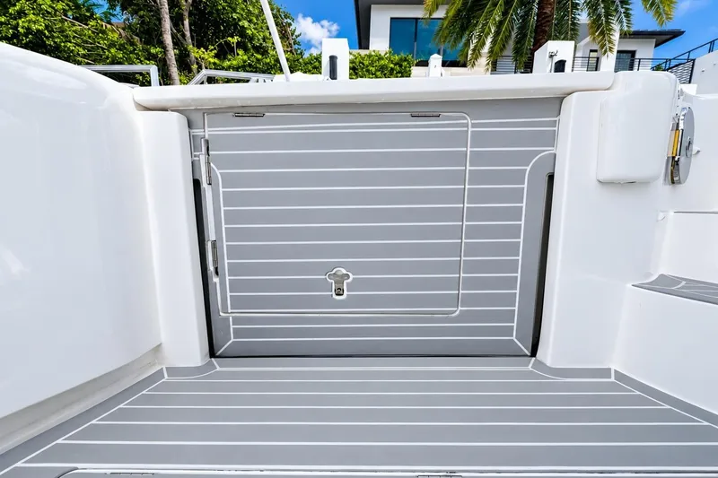 Slide: The Image of 2022 Intrepid 477 Evolution boat deck with sleek gray and white design. - 11