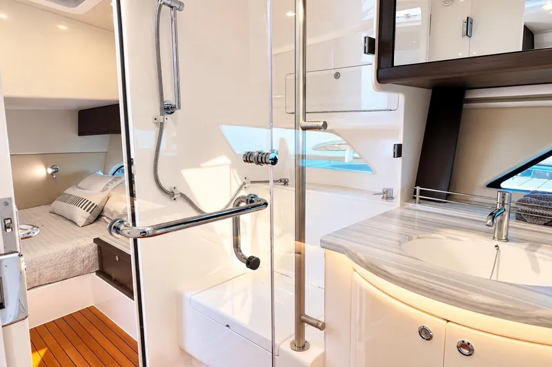 Slide: The Image of Luxurious bathroom and bedroom interior of 2022 Intrepid 477 Evolution yacht. - 44