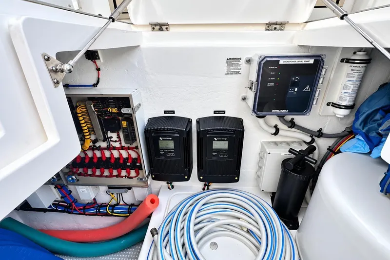 Slide: The Image of Electrical system and components inside a 2022 Intrepid 477 Evolution boat. - 25