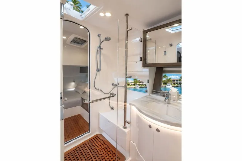 Slide: The Image of Luxurious bathroom interior of 2022 Intrepid 477 Evolution yacht, featuring modern fixtures and elegant design. - 12