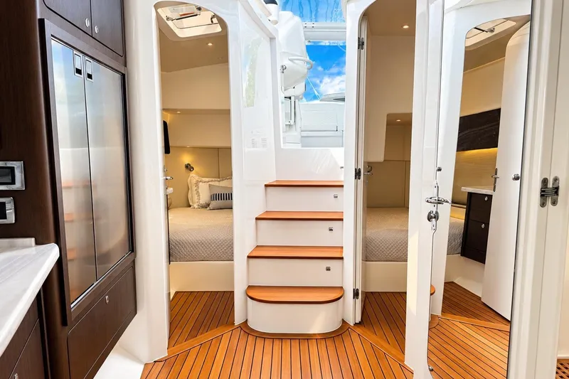 Slide: The Image of Luxurious interior of 2022 Intrepid 477 Evolution yacht with wood flooring and modern design. - 32