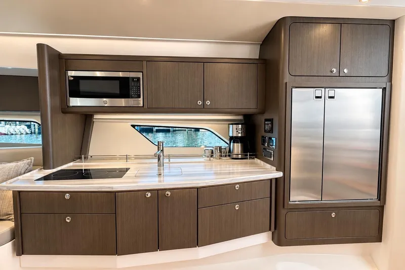 Slide: The Image of Luxurious kitchen interior of 2022 Intrepid 477 Evolution yacht with modern appliances. - 38