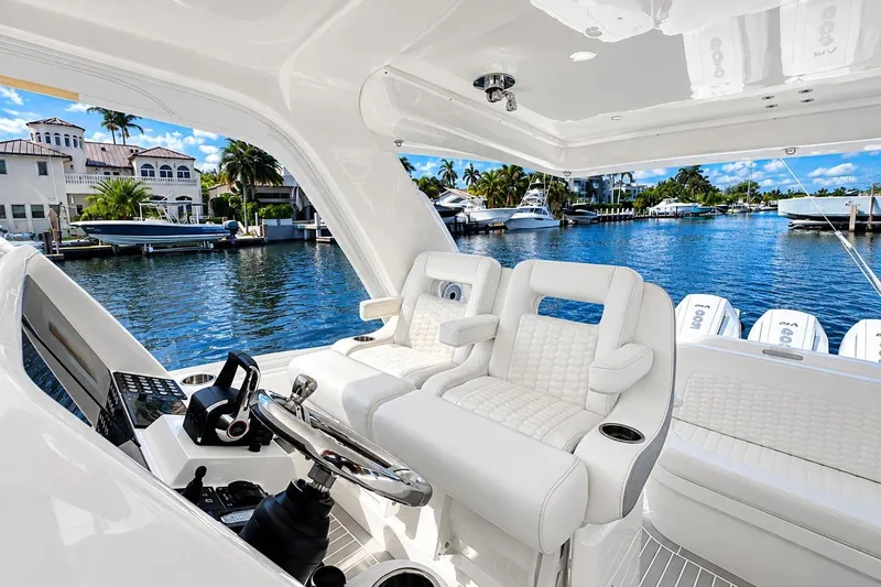 Slide: The Image of Luxurious 2022 Intrepid 477 Evolution yacht interior with waterfront view. - 22