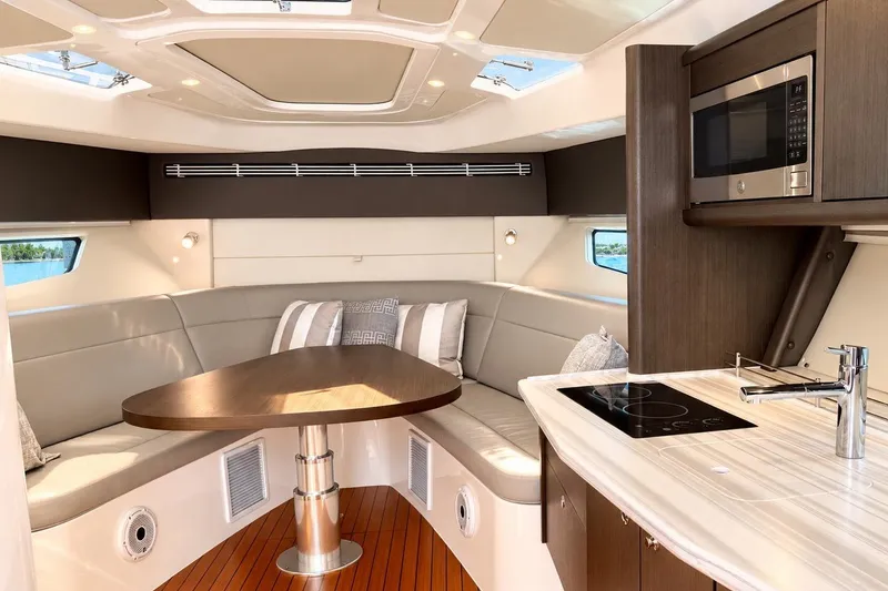 Slide: The Image of Luxurious interior of 2022 Intrepid 477 Evolution yacht with modern kitchen and seating area. - 45