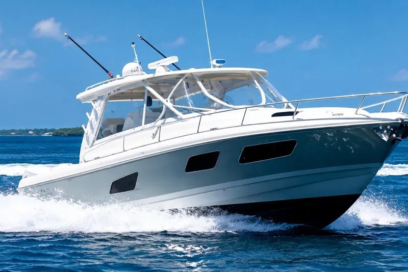 Slide: The Image of 2022 Intrepid 477 Evolution cruising on blue ocean waters. - 5