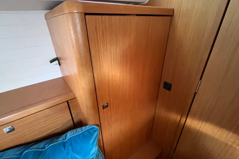 Slide: The Image of Interior of 2013 Bavaria Vision 46 yacht with wooden cabinetry and blue cushion. - 37