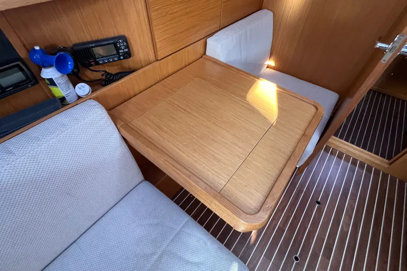 Slide: The Image of Interior of 2013 Bavaria Vision 46 yacht with wooden table and seating area. - 35