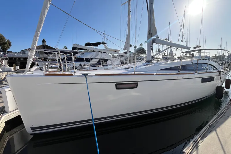 Slide: The Image of 2013 Bavaria Vision 46 sailboat docked at marina under clear blue sky. - 0