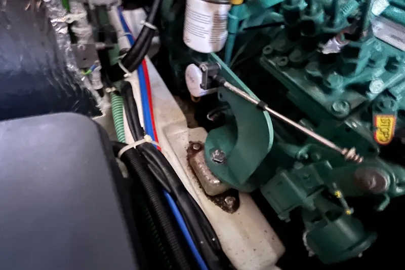 Slide: The Image of Engine compartment of a 2013 Bavaria Vision 46 sailboat, showcasing mechanical components. - 43