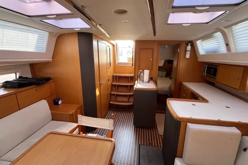 Slide: The Image of Interior of 2013 Bavaria Vision 46 yacht, featuring modern wood finishes and spacious layout. - 17
