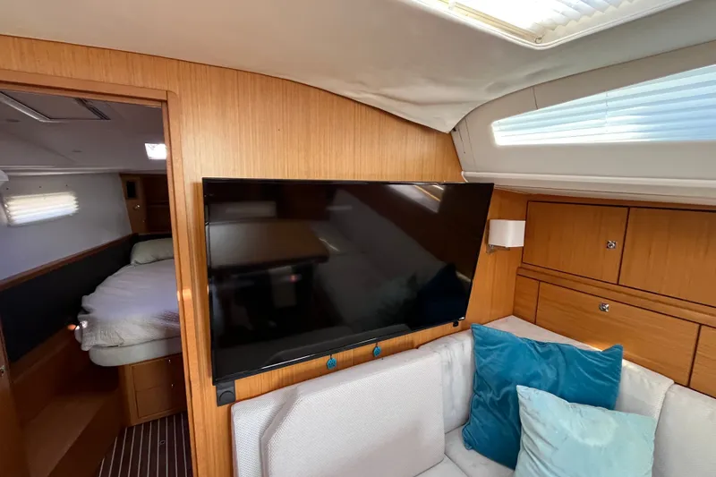 Slide: The Image of Interior of 2013 Bavaria Vision 46 yacht with TV, sofa, and cabin view. - 27