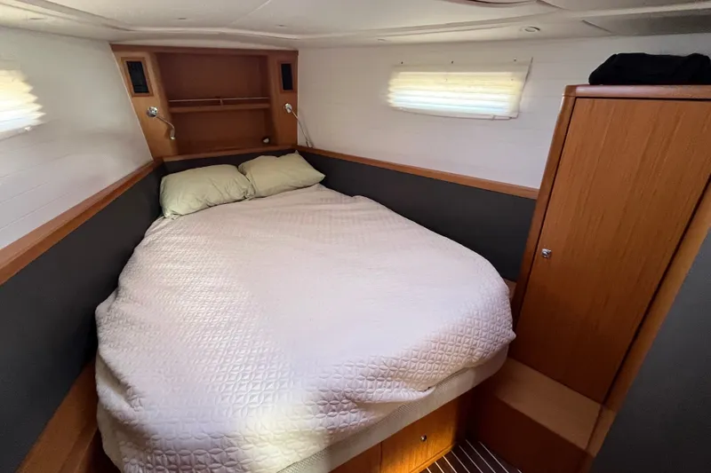 Slide: The Image of Cozy cabin interior of 2013 Bavaria Vision 46 yacht with double bed and wooden furnishings. - 30