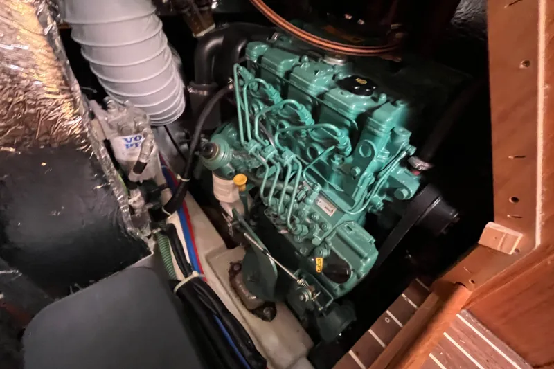 Slide: The Image of Engine compartment of a 2013 Bavaria Vision 46 sailboat, featuring a Volvo Penta engine. - 44
