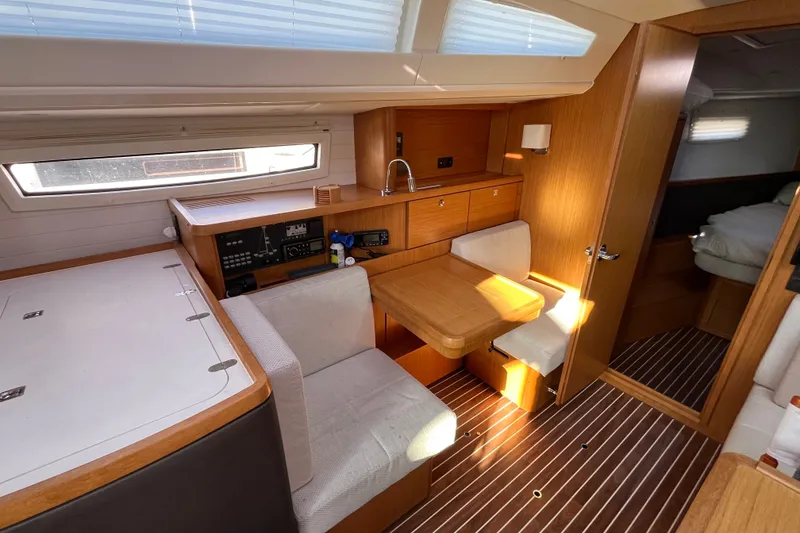 Slide: The Image of Interior of 2013 Bavaria Vision 46 yacht with cozy seating and wooden finishes. - 34