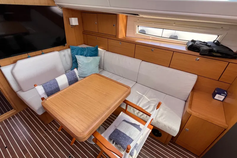 Slide: The Image of Interior of 2013 Bavaria Vision 46 yacht with cozy seating and wooden table. - 19