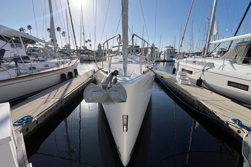 Slide: The Image of Sailboat Bavaria Vision 46, 2013 model, docked at marina under clear blue sky. - 1