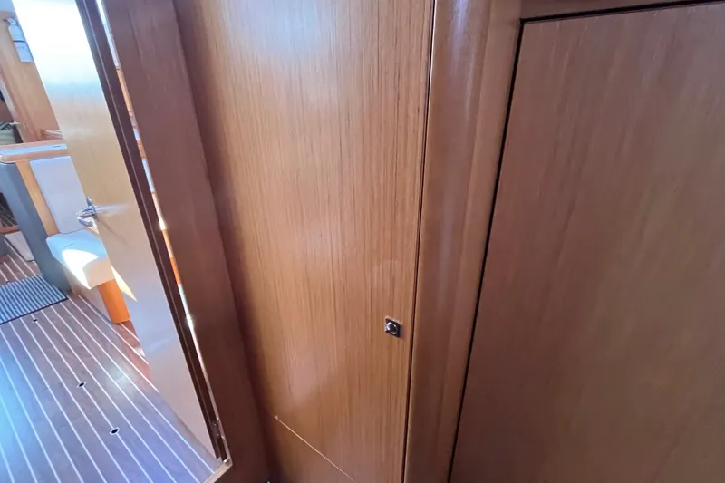 Slide: The Image of Interior of 2013 Bavaria Vision 46 yacht with wooden paneling and open door. - 32