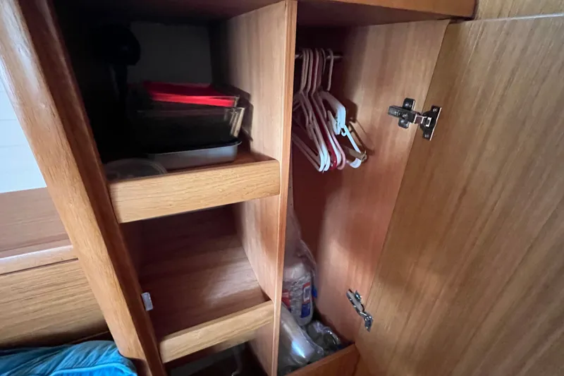 Slide: The Image of Wooden cabinet interior with shelves and hangers on a 2013 Bavaria Vision 46 yacht. - 38