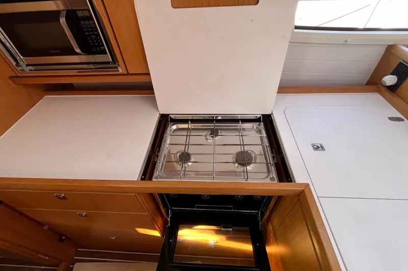 Slide: The Image of Modern kitchen area in a 2013 Bavaria Vision 46 yacht with stove and microwave. - 24