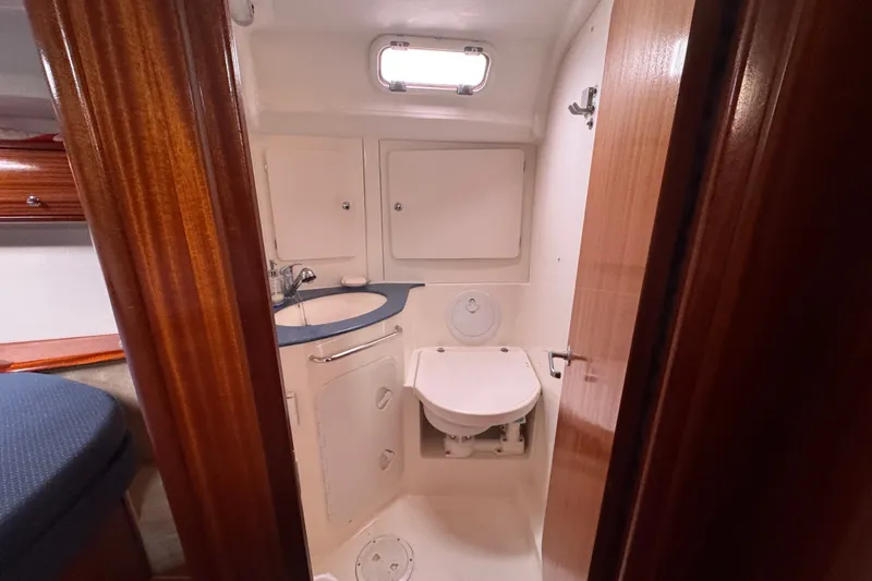 Slide: The Image of Bathroom interior of 2003 Bavaria Cruiser 44 yacht, featuring sink and toilet. - 14