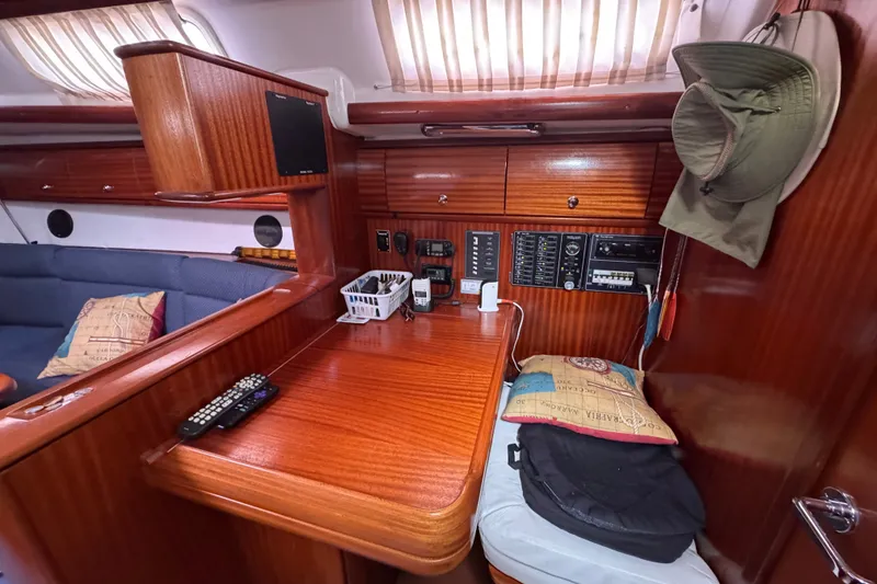 Slide: The Image of Interior of 2003 Bavaria Cruiser 44 yacht with wooden finish and navigation equipment. - 18