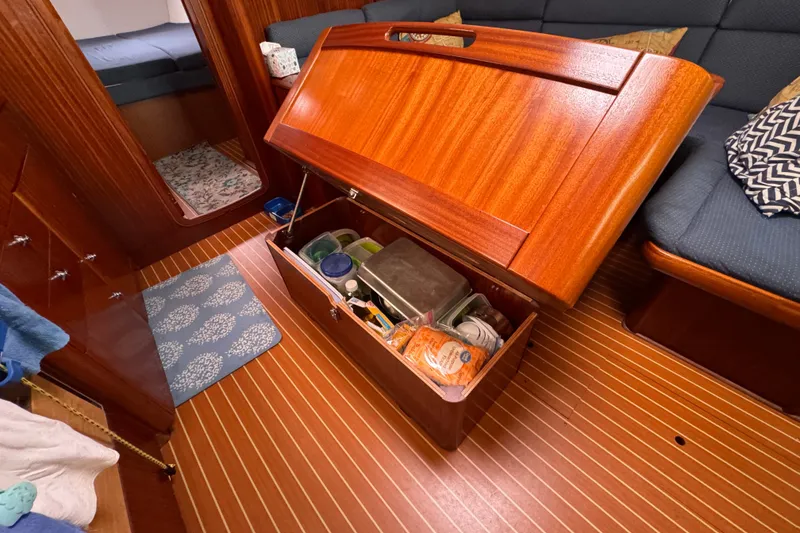 Slide: The Image of Interior storage compartment of a 2003 Bavaria Cruiser 44 yacht, showcasing organized supplies. - 17
