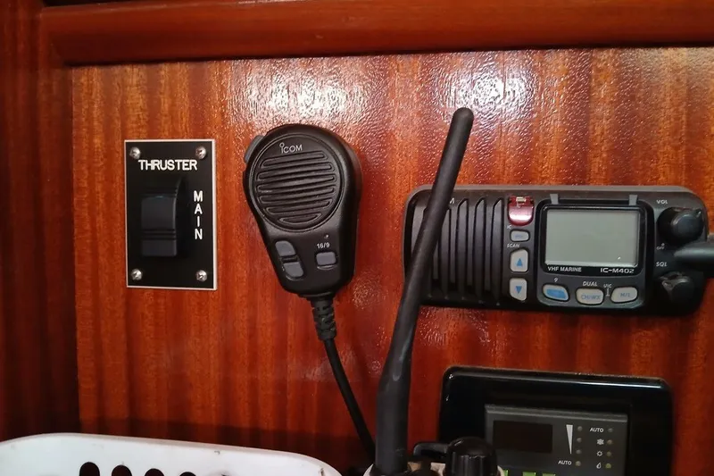 Slide: The Image of Control panel of a 2003 Bavaria Cruiser 44 yacht with thruster switch and VHF radio. - 24