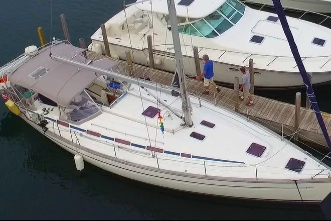 Slide: The Image of 2003 Bavaria Cruiser 44 sailboat docked at marina, aerial view. - 36