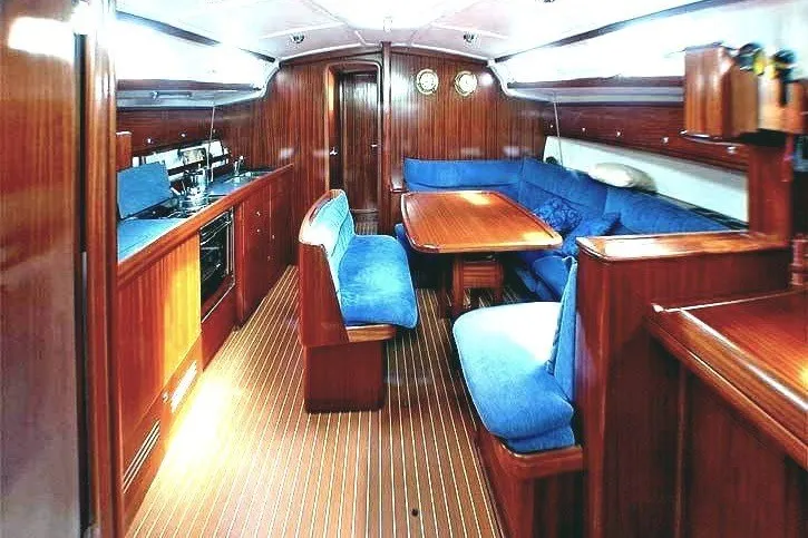 Slide: The Image of Interior of 2003 Bavaria Cruiser 44 yacht with wooden finish and blue seating. - 39