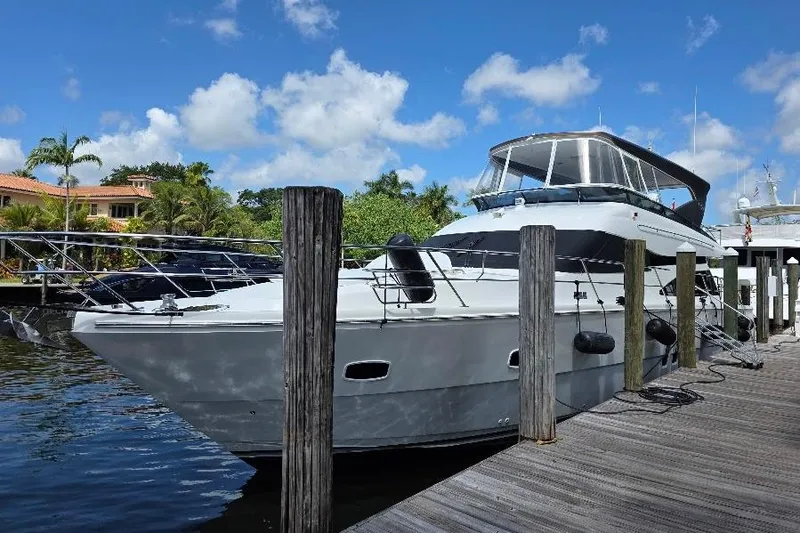 Slide: The Image of 2008 Neptunus Flybridge MY yacht docked under a clear blue sky. - 180
