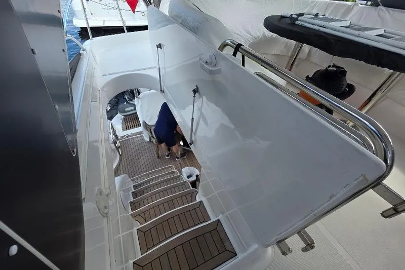 Slide: The Image of Staircase on 2008 Neptunus Flybridge MY yacht, featuring sleek design and wooden steps. - 47