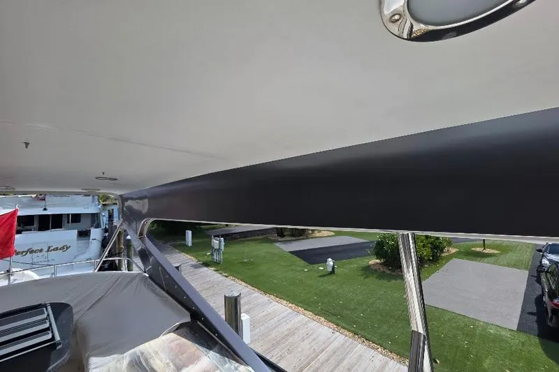 Slide: The Image of 2008 Neptunus Flybridge MY yacht docked, featuring sleek design and spacious deck area. - 43