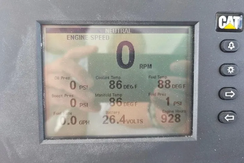 Slide: The Image of Display panel of 2008 Neptunus Flybridge MY showing engine metrics and CAT logo. - 158