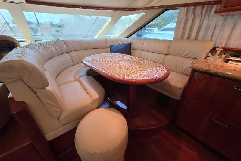 Slide: The Image of Luxurious interior of 2008 Neptunus Flybridge MY yacht with plush seating and elegant table. - 57