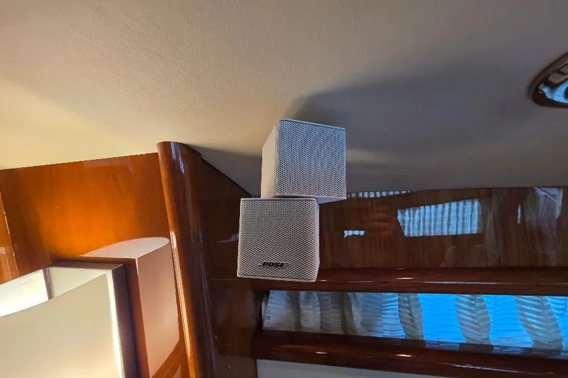 Slide: The Image of Bose speakers in 2008 Neptunus Flybridge MY yacht interior, featuring wood paneling. - 89