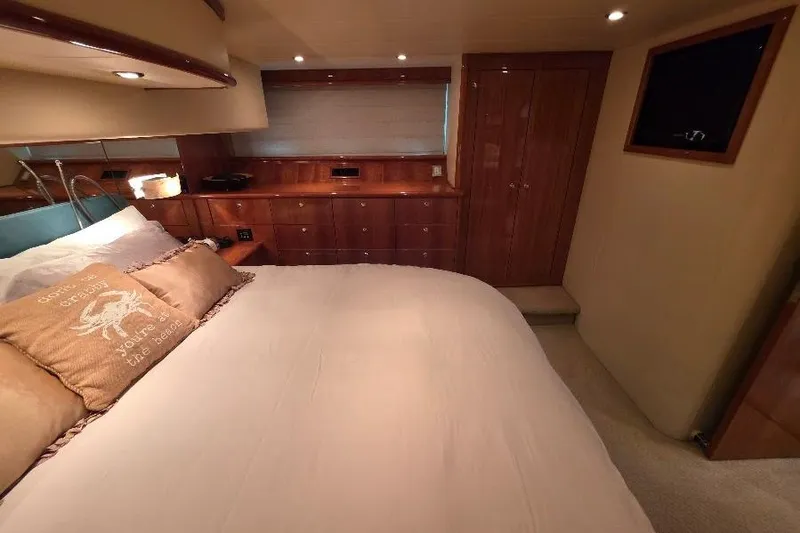 Slide: The Image of Luxurious bedroom interior of 2008 Neptunus Flybridge MY yacht with wooden cabinetry. - 147