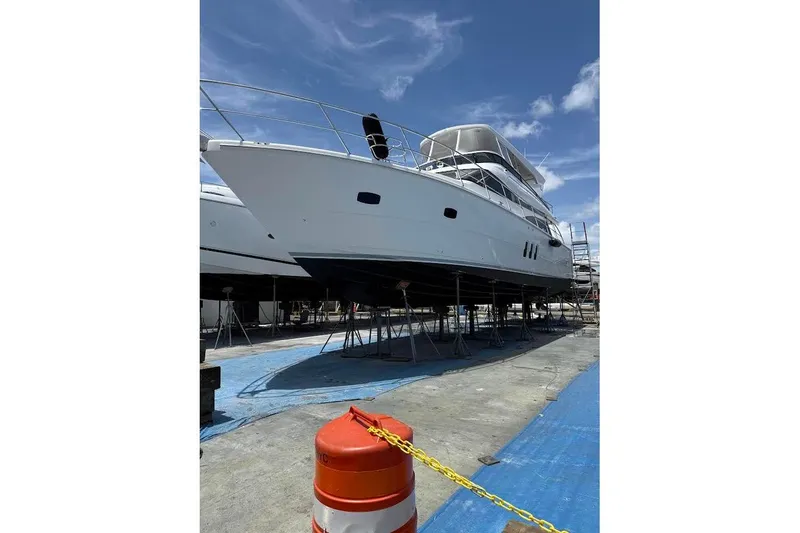 Slide: The Image of 2008 Neptunus Flybridge MY yacht on dry dock under clear blue sky. - 175