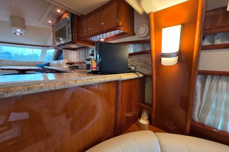 Slide: The Image of Luxurious 2008 Neptunus Flybridge MY yacht interior with elegant wood finishes and modern amenities. - 99