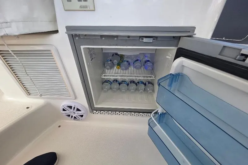 Slide: The Image of Mini fridge stocked with water bottles on a 2008 Neptunus Flybridge MY yacht. - 44