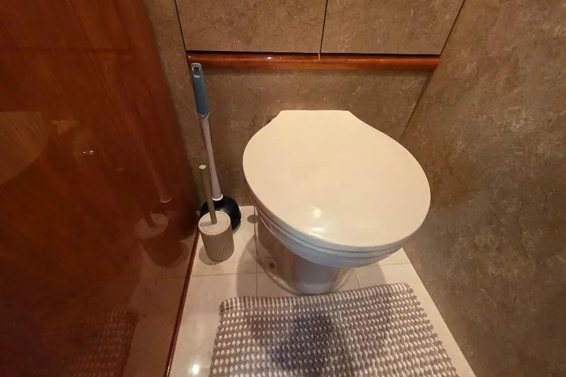 Slide: The Image of Bathroom interior of 2008 Neptunus Flybridge MY yacht with toilet and cleaning brush. - 142