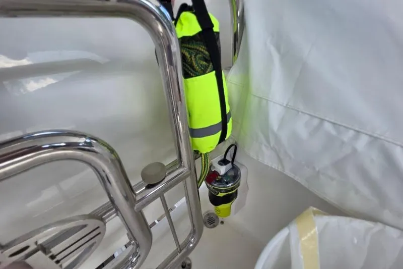 Slide: The Image of Safety equipment on 2008 Neptunus Flybridge MY yacht, featuring bright yellow gear and chrome railing. - 46