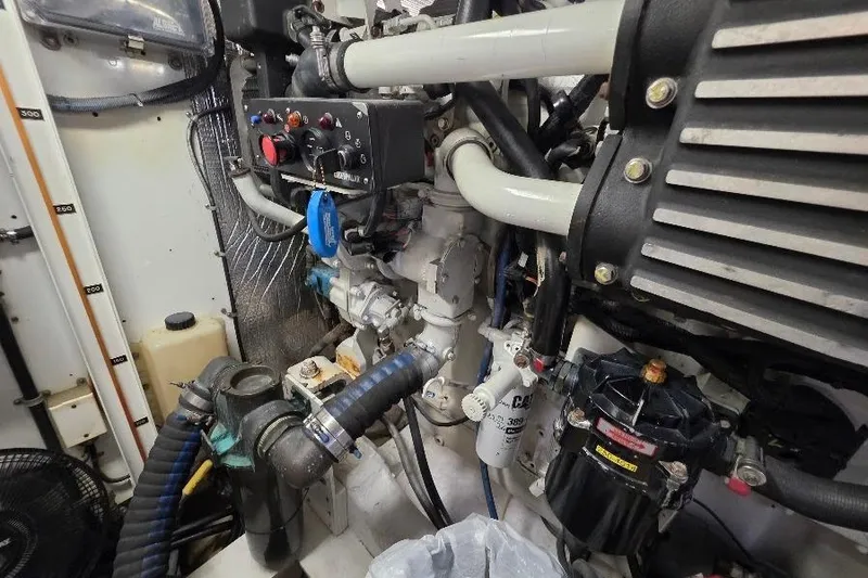 Slide: The Image of Engine room of 2008 Neptunus Flybridge MY with visible mechanical components and hoses. - 160