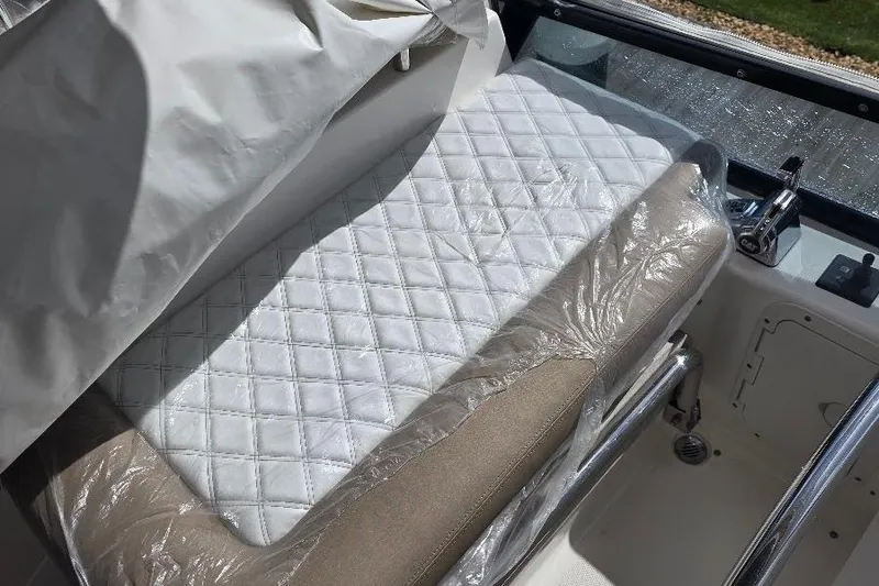 Slide: The Image of Luxurious seating on 2008 Neptunus Flybridge MY, featuring quilted white upholstery. - 30