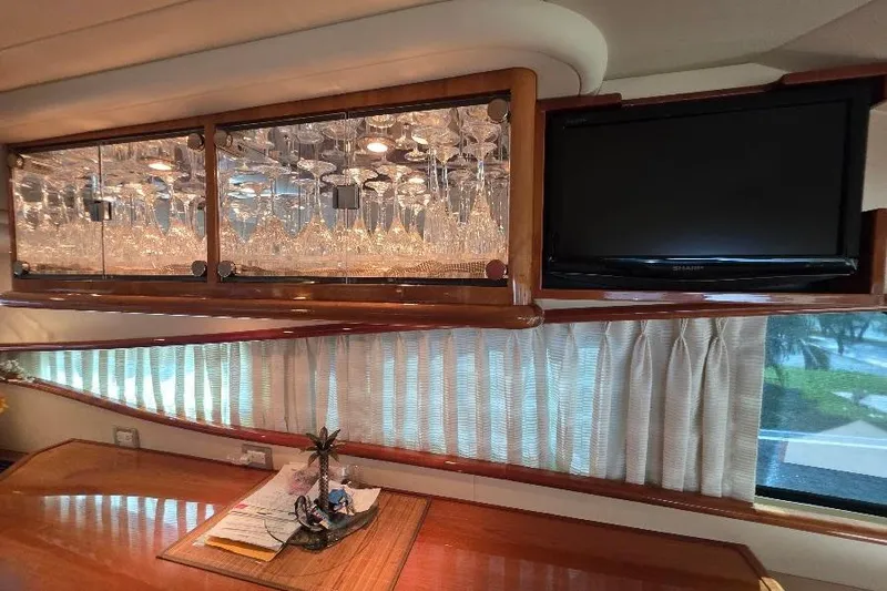 Slide: The Image of Luxurious interior of 2008 Neptunus Flybridge MY yacht with glassware and TV. - 73