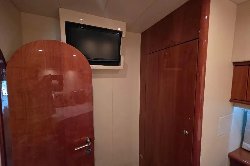 Slide: The Image of Interior of 2008 Neptunus Flybridge MY yacht with wood paneling and mounted TV. - 118