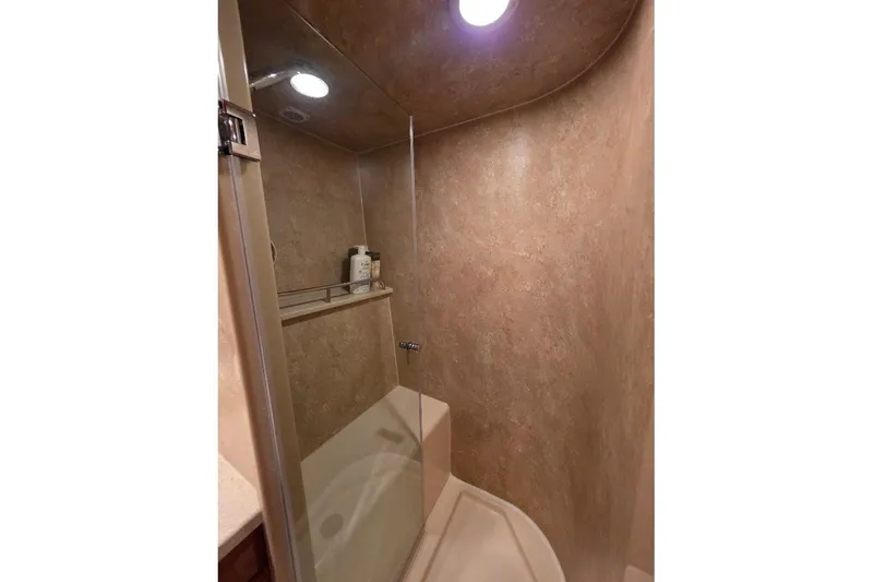 Slide: The Image of Shower area in 2008 Neptunus Flybridge MY yacht with beige walls and glass door. - 145