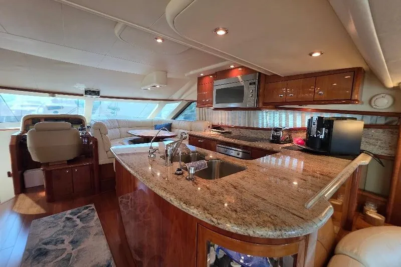 Slide: The Image of Luxurious 2008 Neptunus Flybridge MY yacht interior with modern kitchen and seating area. - 54